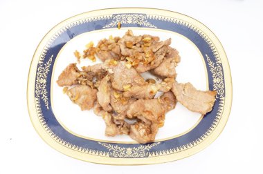 Sarımsak ve biber ile Kızartma domuz eti ilave edin