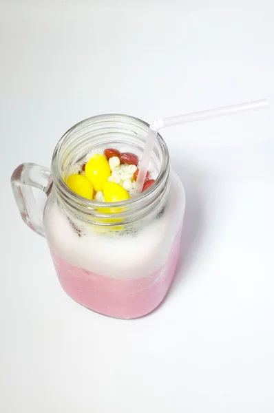 Pink milk in glass mug — Stock Photo, Image