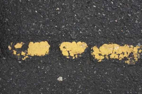 Pale yellow line on the road — Stock Photo, Image