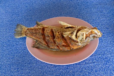 Snapper topped with sauce , Thai seafood