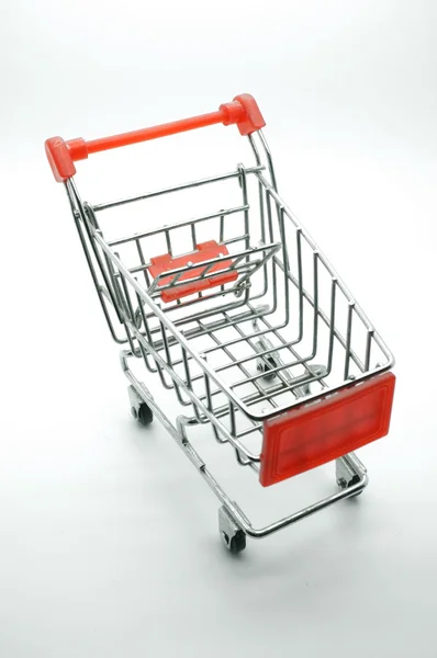 Carrito de compras vacío, vista lateral, sobre fondo blanco . — Foto de Stock