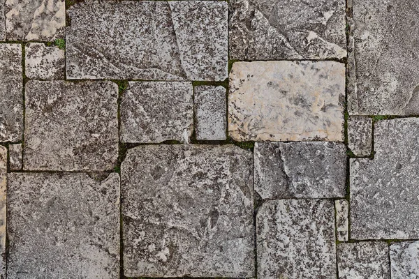 Stone wall texture photo background. Stone wall as background or texture, natural color.