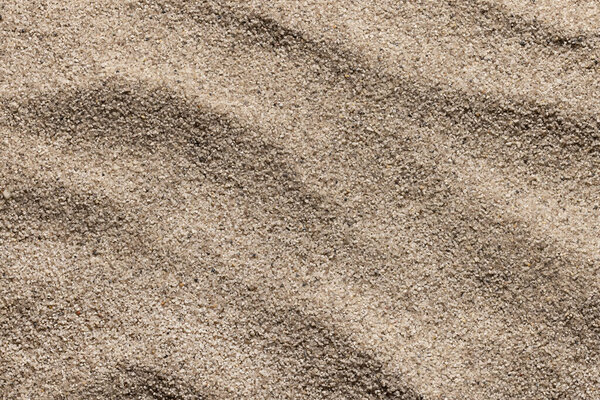 Обои, фон морского песка в виде дюн. Лето, отдых и морская концепция.