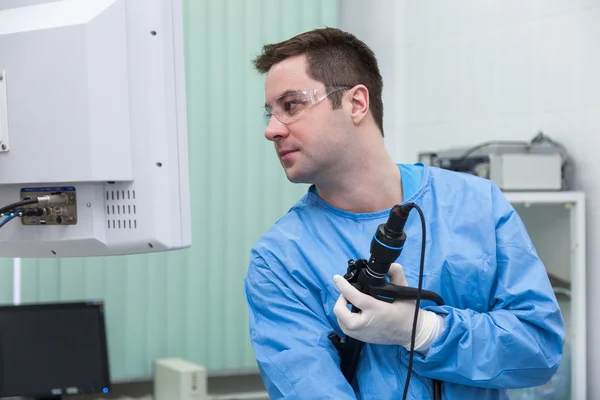 Doctor Gastroenterologist with an endoscope