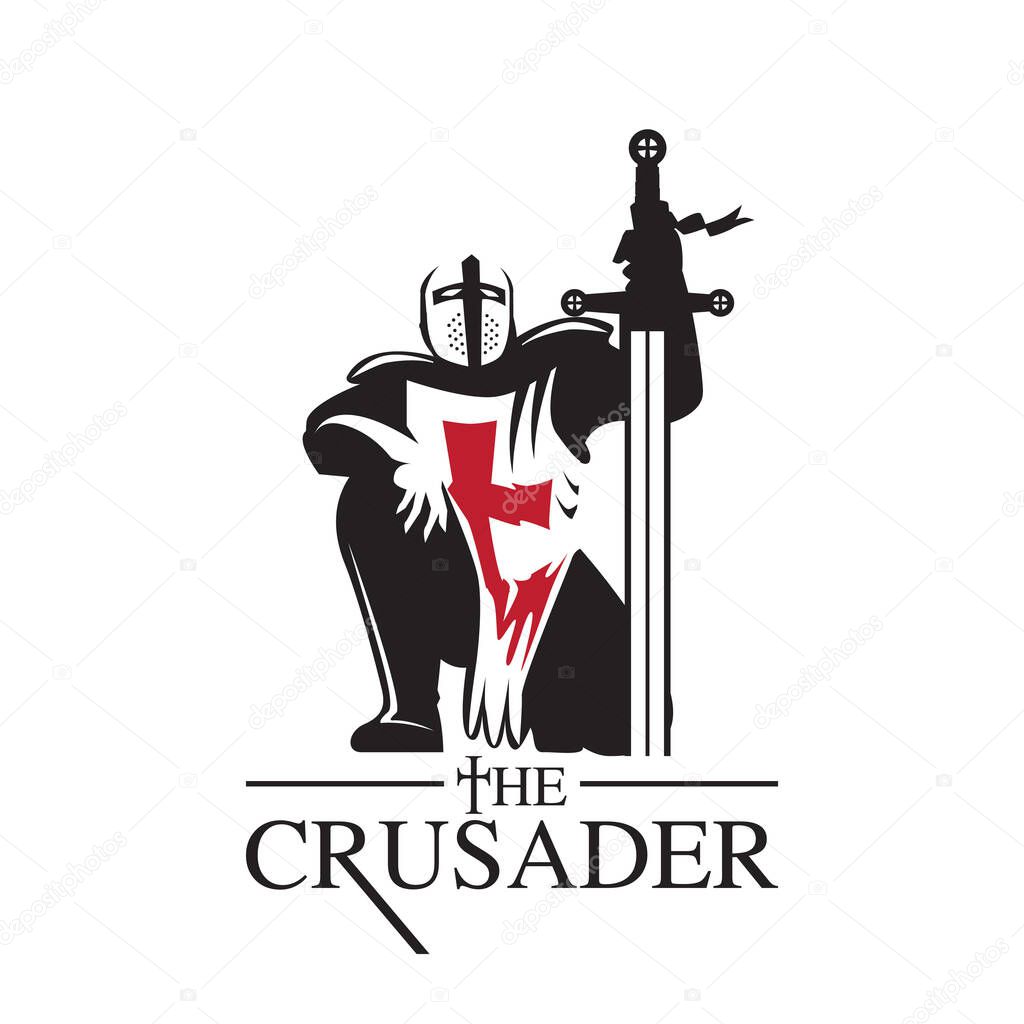 Crusader Knight prays to God as he stands his sword as the Cross