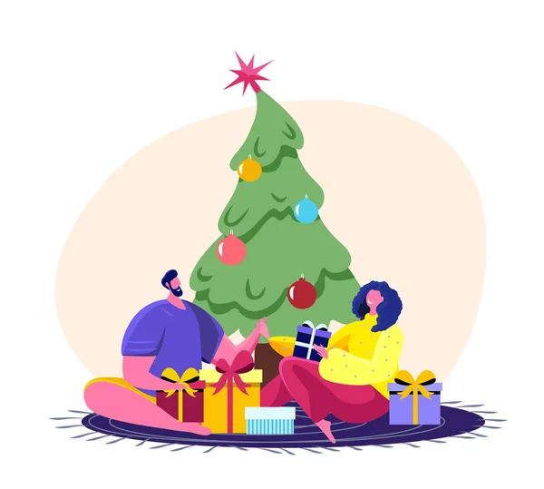 欢欢喜喜的人们庆祝新年及圣诞佳节爱家庭的男女老少妻子和丈夫坐在装饰好的枞树树旁 互相送礼卡通画平面病媒图解 — 图库矢量图片