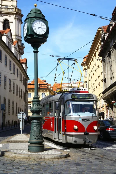 Tram and old clock in Prague — Stock Photo, Image