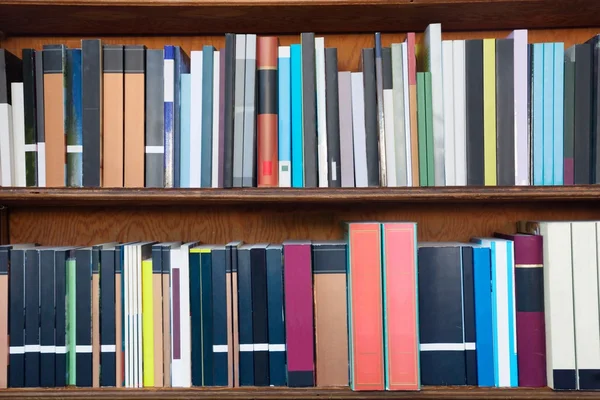 Books on the shelves of a library — Stock Photo, Image