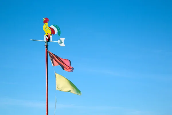 Colorful weathercock with flags — Stock Photo, Image