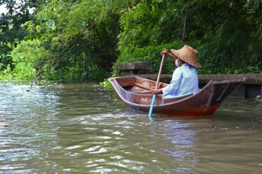 Thai woman paddling
