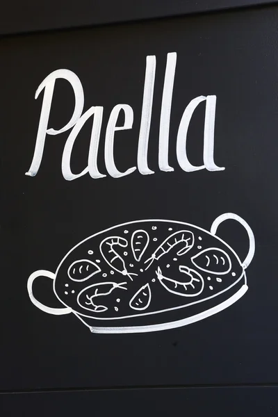 Iscrizione Paella sulla lavagna del ristorante — Foto Stock