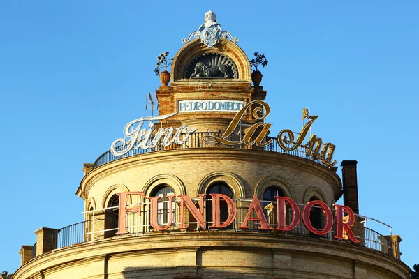 Alcohol brands retro signs on roof — Stock Photo, Image