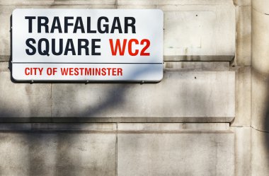 Trafalgar Square sign on gray wall