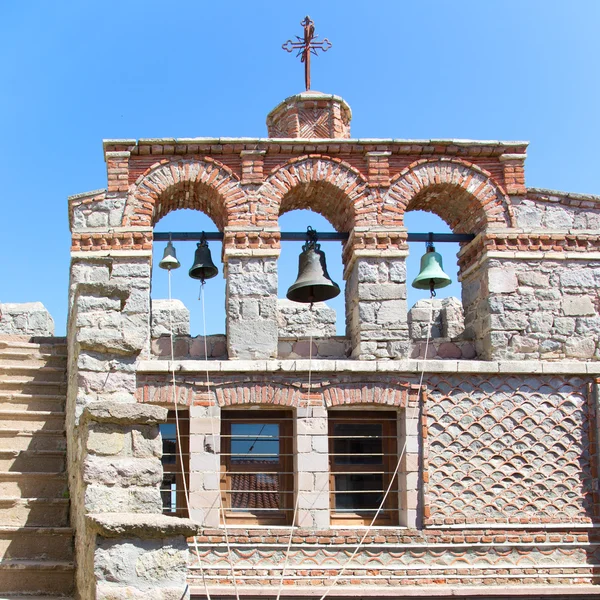 Bells on stone wall in monastery — Stok fotoğraf