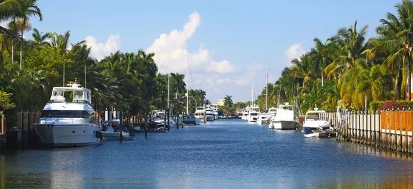 Yachts on narrow canal Stock Picture