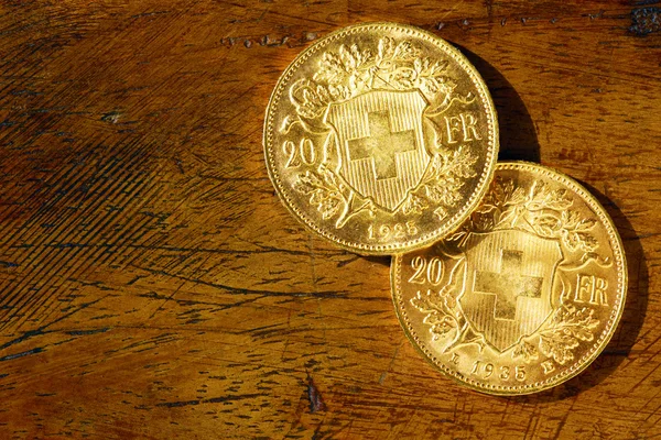 Two swiss golden coins — Stok fotoğraf