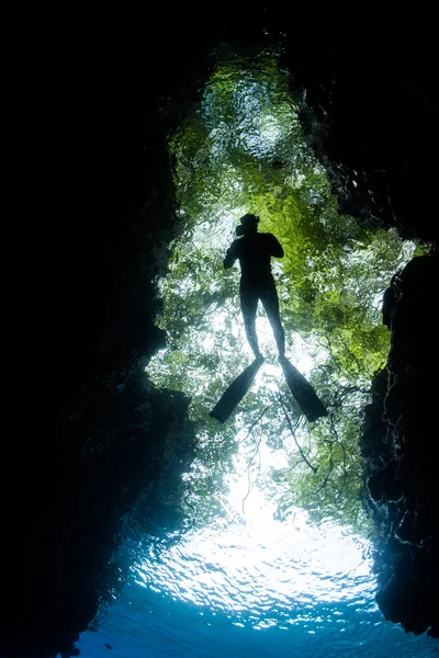 Snorkeler and Dark Grotto — Stock Photo, Image
