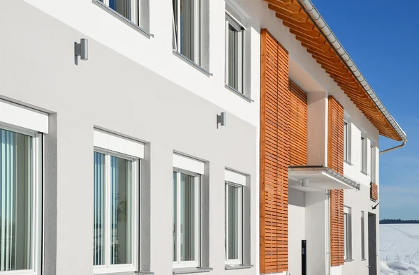 Facade of a modern commercial building shortly after its completion in Winter — Stock Photo, Image