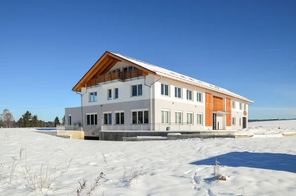 Facade of a modern commercial building shortly after its completion in Winter — Stock Photo, Image