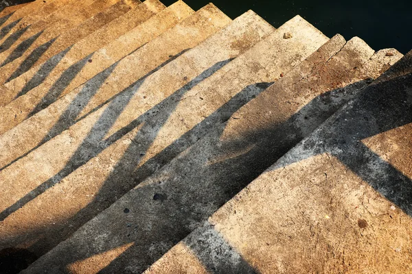 Grunge shadow of concrete stair in a public park at the dayligh — Stock Photo, Image