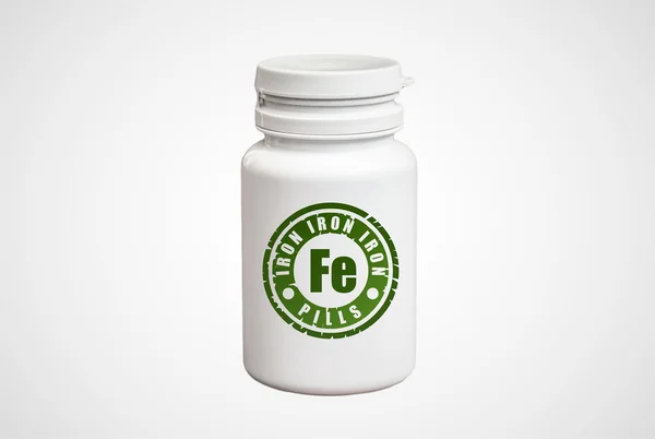 Бутылка таблеток с железом Fe — стоковое фото