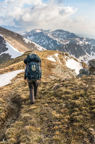 Young man climb on mountain hill — Stock Photo, Image