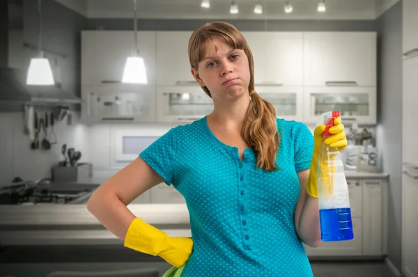 Tired housewife woman in yellow gloves — Stock Photo, Image