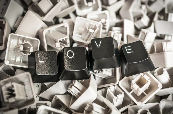 Vista de cerca de algunas teclas con la palabra AMOR — Foto de Stock