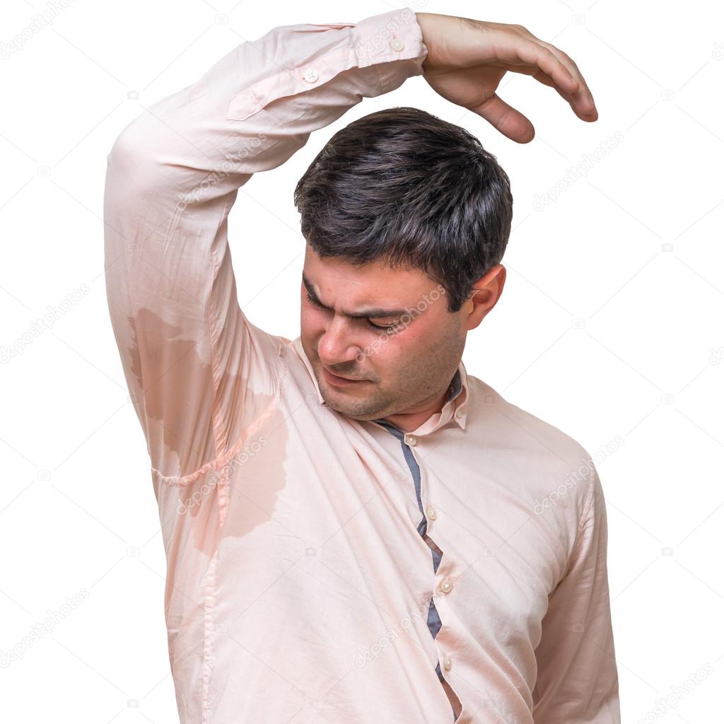 Man with sweating under armpit in pink shirt isolated on white