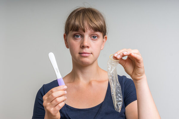 Hole in condom and positive pregnancy test