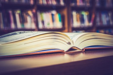 Opened book on the table - retro and vintage style
