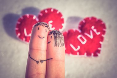 Happy fingers on a snow background with two hearts - retro and v