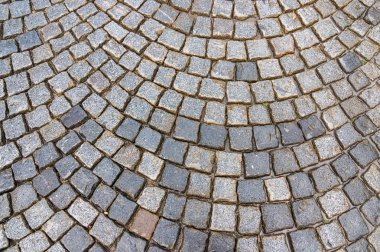 Grey cobblestone pavement after the rain in the Czech Republic clipart