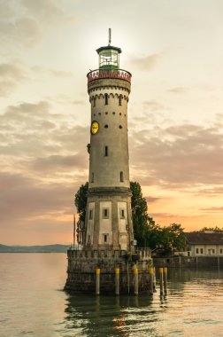Lighthouse and sunset in harbor of Lindau in lake Constance