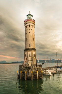 Lighthouse and sunset in harbor of Lindau in lake Constance