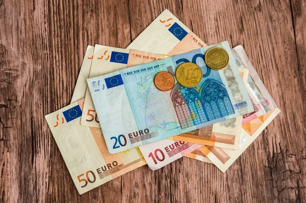 Euro banknotes and euro coins — Stock Photo, Image