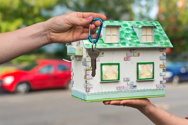 Real estate agent giving house keys to a new property owner, who — Stock Photo, Image