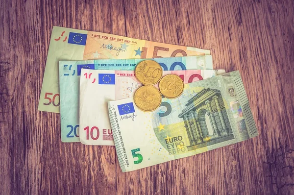 Euro banknotes and euro coins — Stock Photo, Image