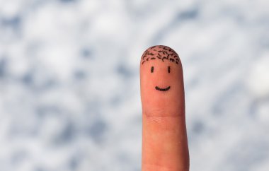 Happy finger on a snow background