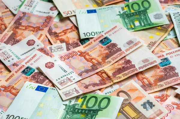 Fondo ruso y euro de billetes —  Fotos de Stock