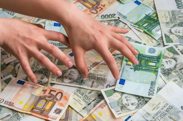Stingy hands takes money — Stock Photo, Image