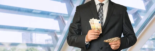 Man in business suit with money