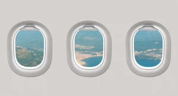 Looking out the windows of a plane to the sea bay — Stock Photo, Image