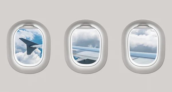 Vue par les fenêtres d'un avion vers l'aile et le clou de l'avion — Photo
