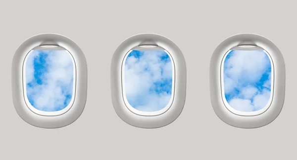 Patrząc przez okna samolotu na błękitne niebo i chmury — Zdjęcie stockowe