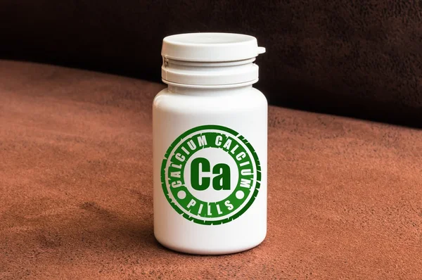 Bottle of pills with calcium — Stock Photo, Image