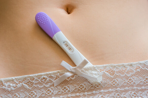 Positive pregnancy test on belly