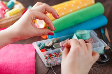 Woman choice from needle box