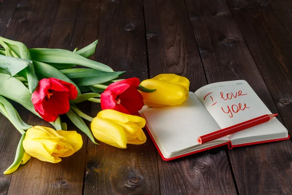 Bunch of tulips and love message — Stock Photo, Image