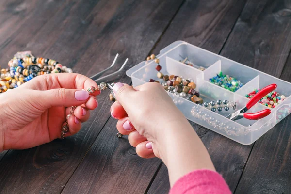 Handmade accessories on wooden table — Stock Photo, Image